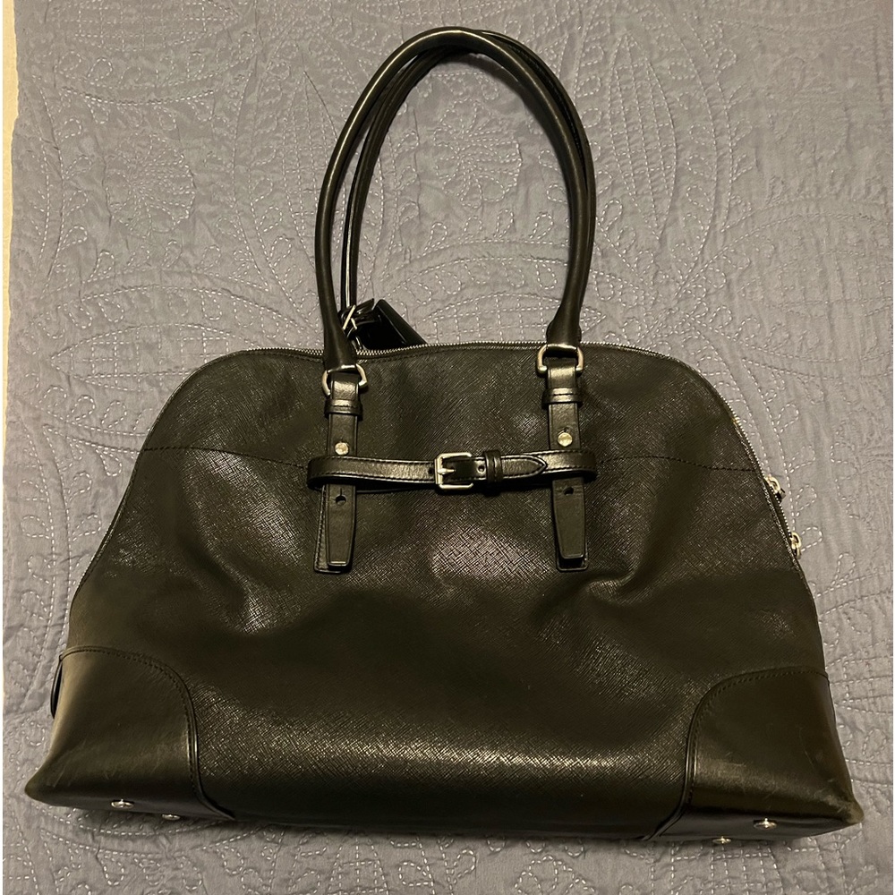 Tumi black leather carry on